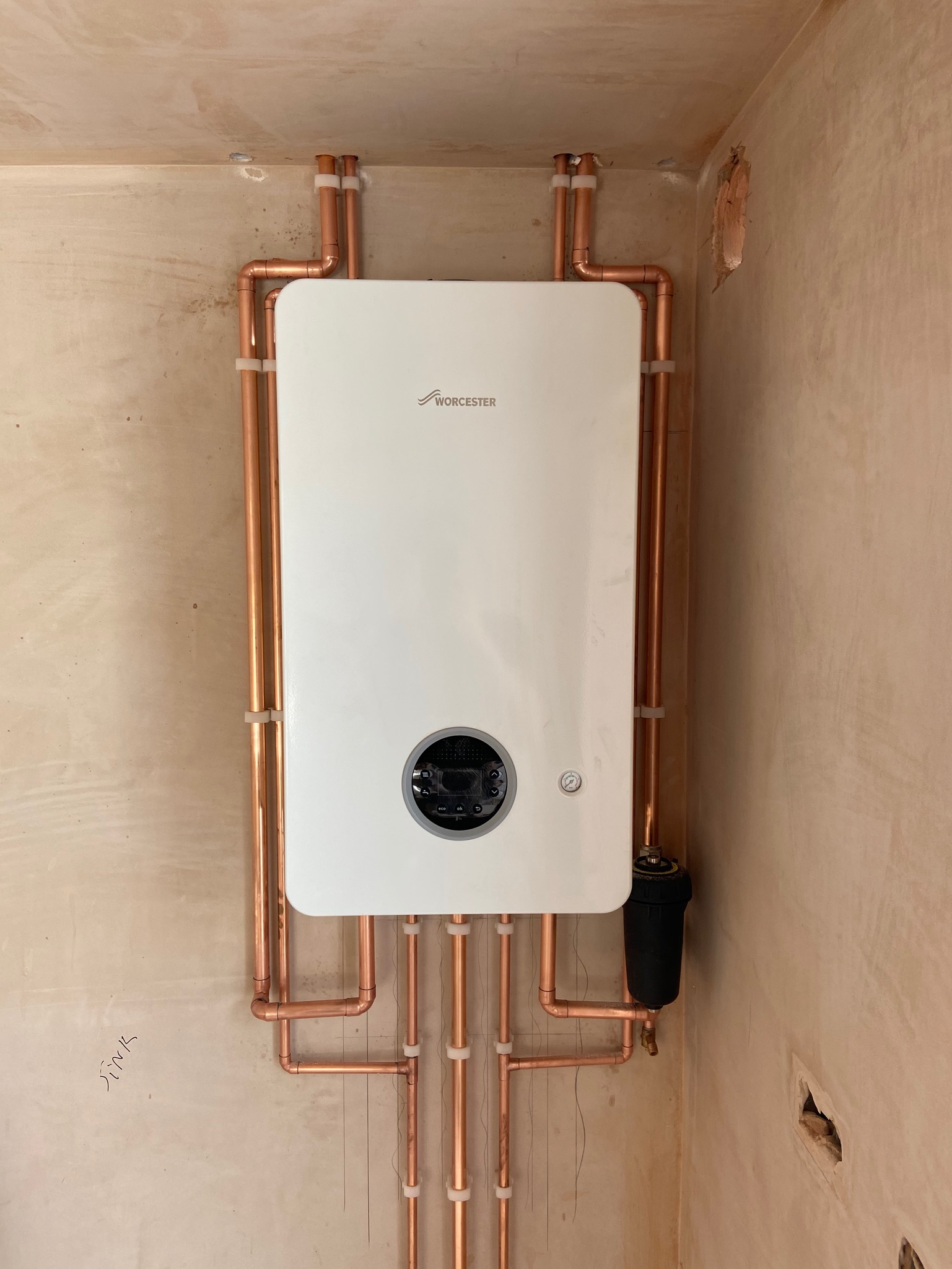 Professional wall-mounted boiler installation